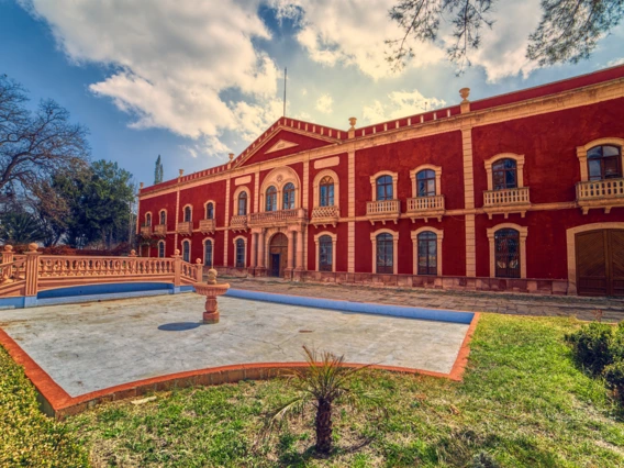 Facade of Gorgorron Hacienda with front garden and fountain