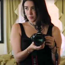 Robie Flores with a camera