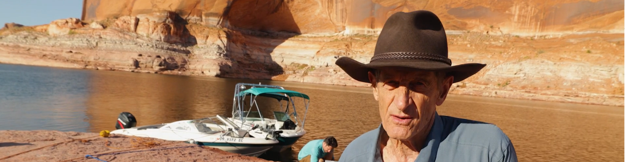 David Yetman with boat and lake powell in the background